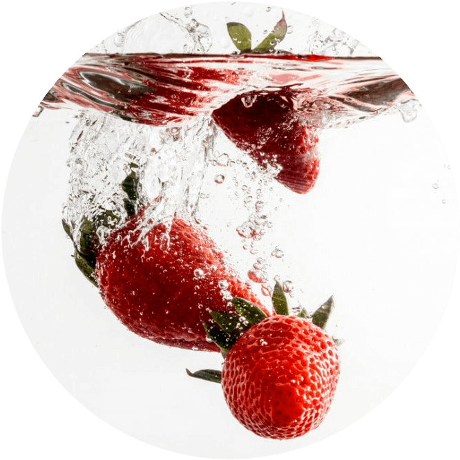 strawberries splashing in water