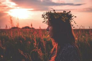 Woman in field with a flower crown